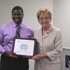 Johnathon receiving award and recognition from Rep. Marcy Kaptur.